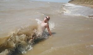 Swimming, splashing and posing naked in the sea...