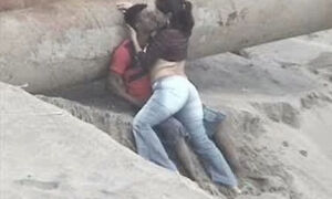 Latino pair caught on the beach