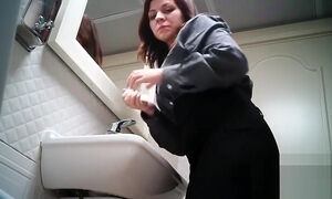 Women pee in public toilet 2259