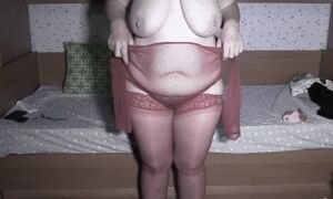 Mature bbw MILF with a big bush on her pussy and big saggy tits changes stockings.