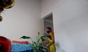 Wife cleans in her yellow dress