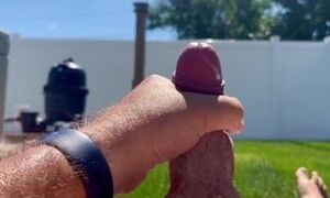 Bearded and tattooed husband jerks off outside to video of MILF wife with cumshot on self