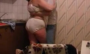 Big grandma get fucked by her boytoy in the kitchen