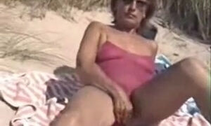 Step mommy with Bushy Cookie Filmed Nude on the Public Beach