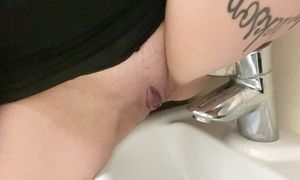 Classy pisses in the sink in the disabled public toilet