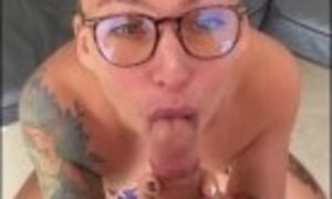 MILF in long socks and glasses sucks cock with a lot of passion